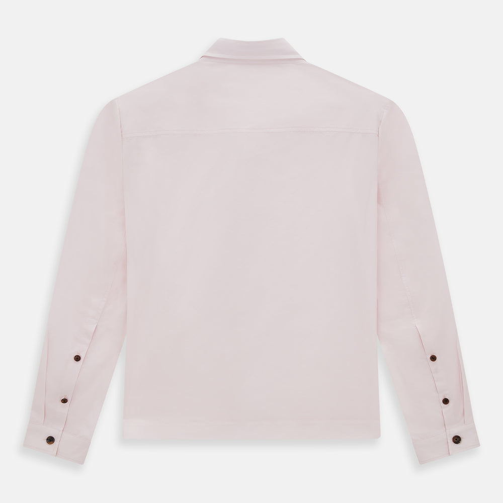 The Soft Pink Hyde Overshirt by Turnbull & Asser features long sleeves, sanforised cotton, dark buttons, and a left front pocket, shown laid flat on a white background.