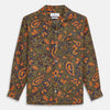 View 1 of product The Turnbull & Asser Khaki Green Floral Silk Holiday Fit Winnington Shirt features a bold floral print with orange, yellow, and purple on an olive background, plus a spread collar and chest pocket for versatile style.