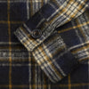 View 3 of product The Turnbull & Asser Navy and Beige Check Wool and Mohair Blend Somerset Overshirt, featuring long sleeves, two chest pockets, and a classic collar, is laid flat on a white background.
