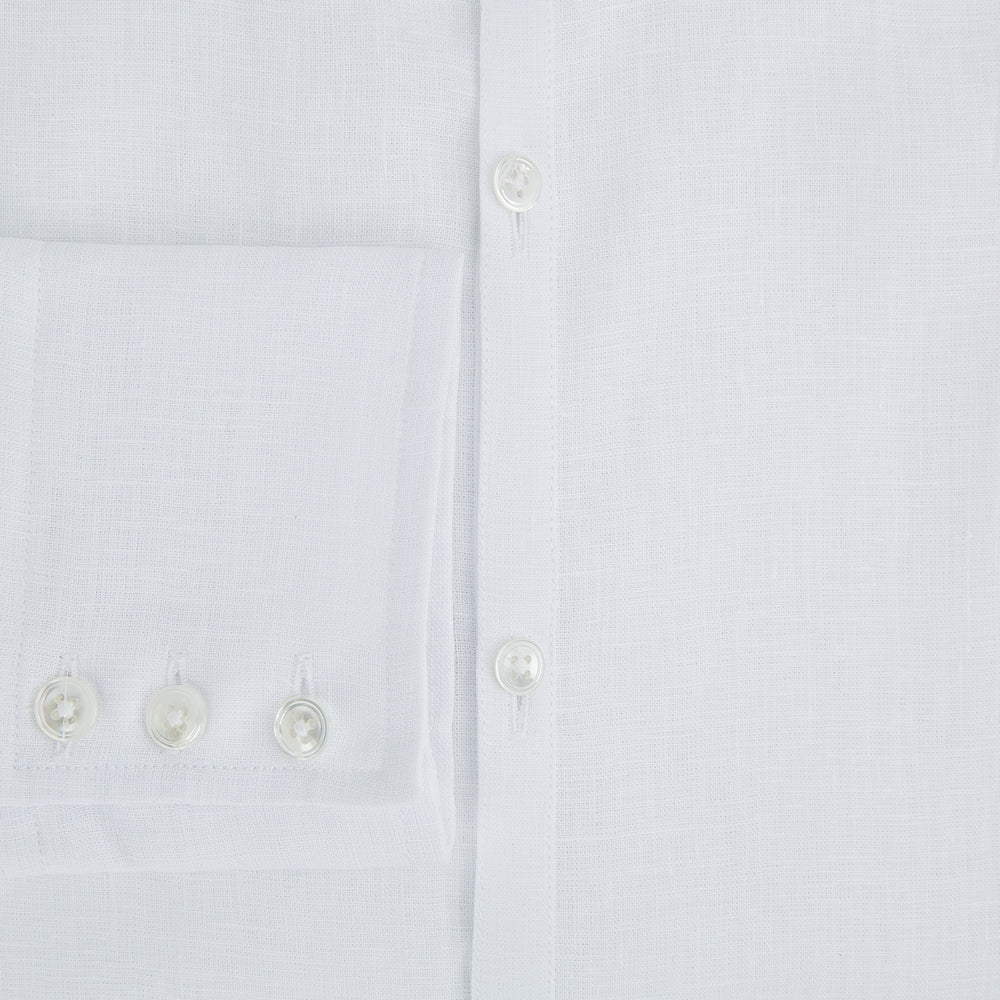 The White Linen Westminster Shirt by Turnbull & Asser features a classic Turnbull collar and button-down front, highlighting British craftsmanship against a plain white background.