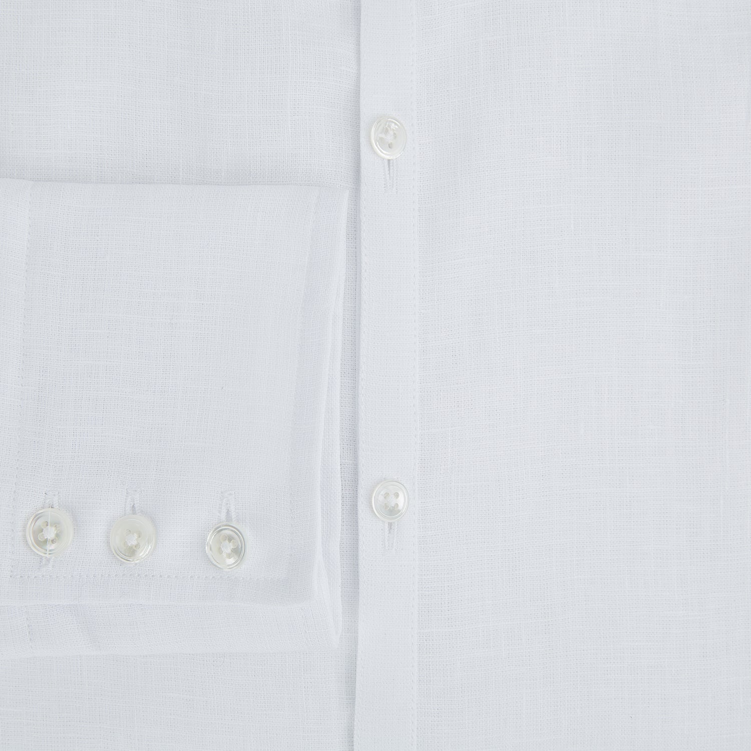 View 4 of product The White Linen Westminster Shirt by Turnbull & Asser features a classic Turnbull collar and button-down front, highlighting British craftsmanship against a plain white background.