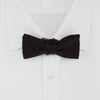 View 2 of product The Turnbull & Asser Black Batwing Satin Bow Tie features a smooth, matte finish and is neatly tied on a plain white background—ideal for formal occasions.