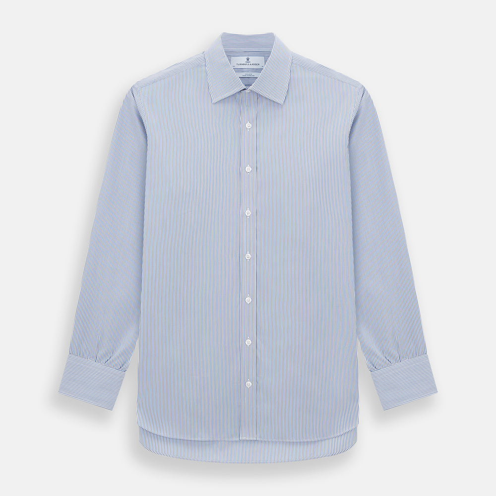 The Turnbull & Asser Pale Blue Pinstripe Mayfair Shirt features pale blue pinstripes, a classic T&A collar, white buttons, and cuffed sleeves, shown against a plain white background.