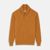 View 1 of product The Turnbull & Asser Gold Cashmere Shawl Neck Lytton Jumper, in ribbed knit with a horn button at the neckline, is stylishly laid flat on a white background.