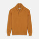 The Turnbull & Asser Gold Cashmere Shawl Neck Lytton Jumper, in ribbed knit with a horn button at the neckline, is stylishly laid flat on a white background.