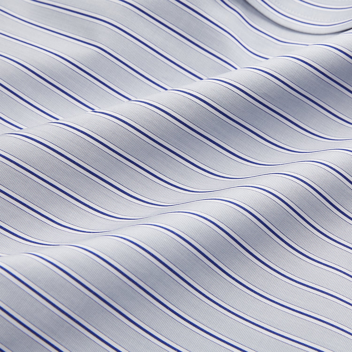 View 4 of product Turnbull & Asser Navy & Blue Stripe Weekend Fit Shirt, featuring a Derby collar, single button cuffs, and a chest pocket, laid flat on a white background.