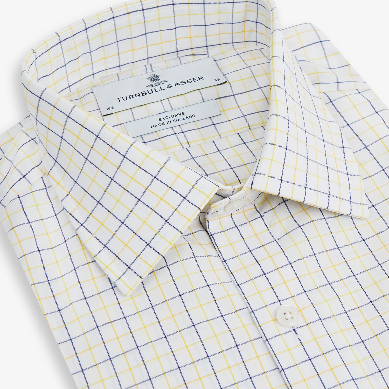View 2 of product The Turnbull & Asser Yellow Overlay Grid Check Mayfair Shirt is a long-sleeve, button-down shirt made from soft organic cotton, featuring a yellow grid check pattern and shown laid flat on a white background.