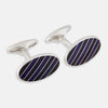View 1 of product Turnbull & Asser Navy Striped Oval Enamel Cufflinks feature navy blue and black diagonal stripes, shiny silver edges, and a modern oval shape—reflecting masculine elegance in every detail.