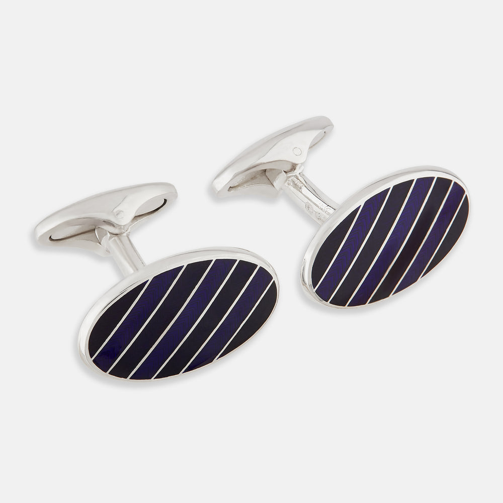 Turnbull & Asser Navy Striped Oval Enamel Cufflinks feature navy blue and black diagonal stripes, shiny silver edges, and a modern oval shape—reflecting masculine elegance in every detail.