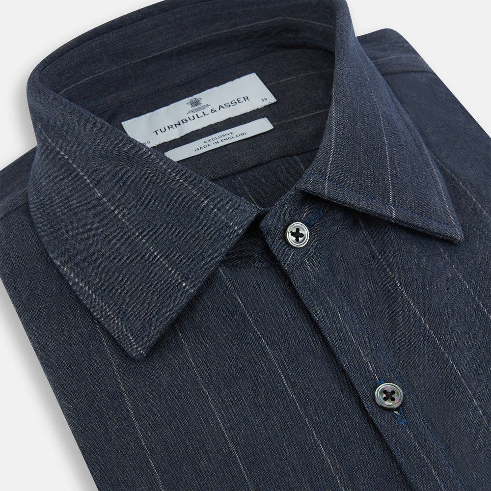 The Turnbull & Asser Navy Melange Wide Stripe Westminster Shirt features a classic collar, buttoned cuffs, and a tailored fit, showcasing British craftsmanship. Laid flat on a white background.