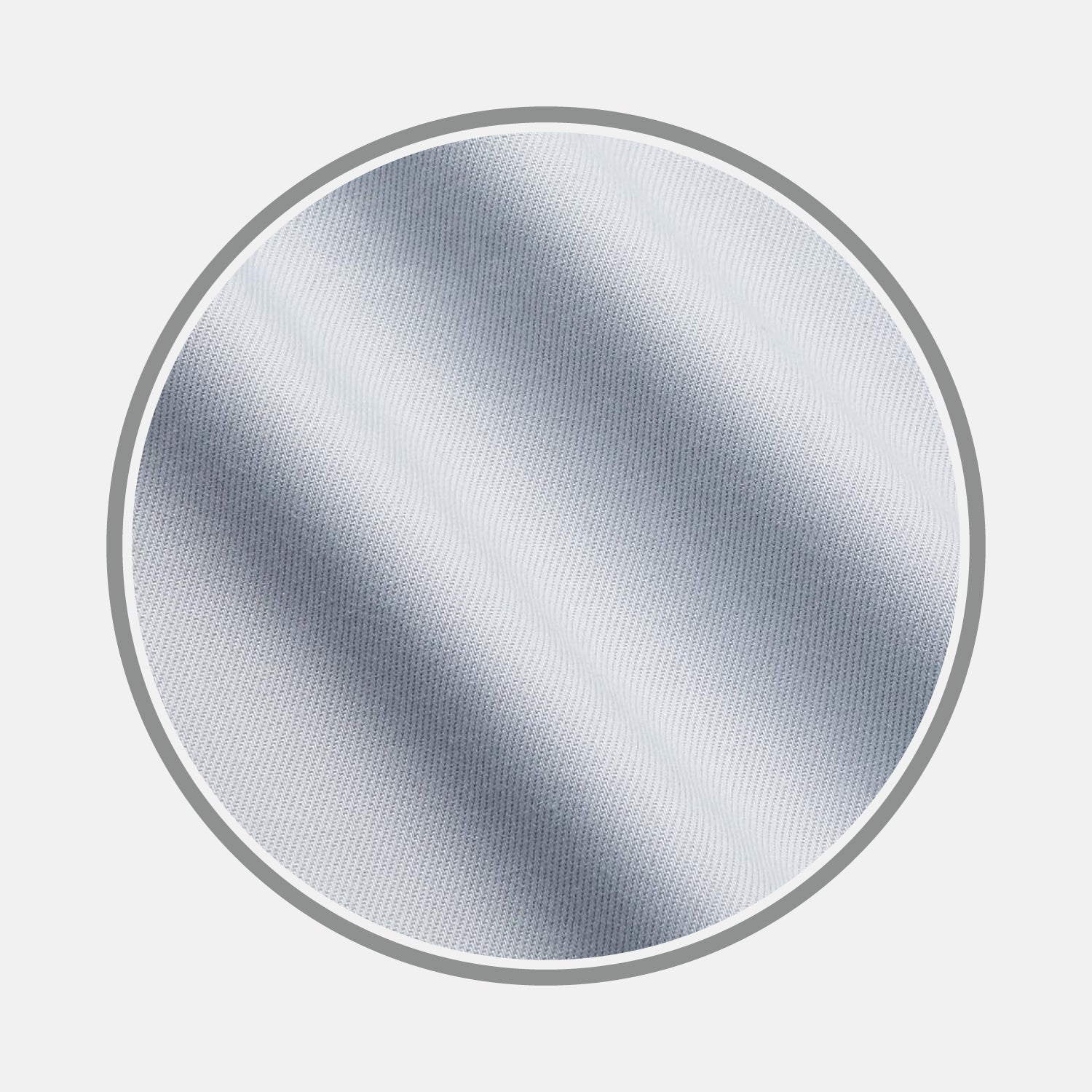 View 1 of product A close-up of Turnbull & Asser's Plain Grey Cotton Fabric shows its textured surface with diagonal lines and soft shadows, presented inside a circular frame on a white background.