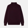 View 1 of product The Turnbull & Asser Burgundy Mullion Half Zip Rib Cashmere Jumper features a high collar and half-zip front in dark red and navy cashmere, shown laid flat on a white background—ideal for an elevated casual look.