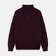The Turnbull & Asser Burgundy Mullion Half Zip Rib Cashmere Jumper features a high collar and half-zip front in dark red and navy cashmere, shown laid flat on a white background—ideal for an elevated casual look.