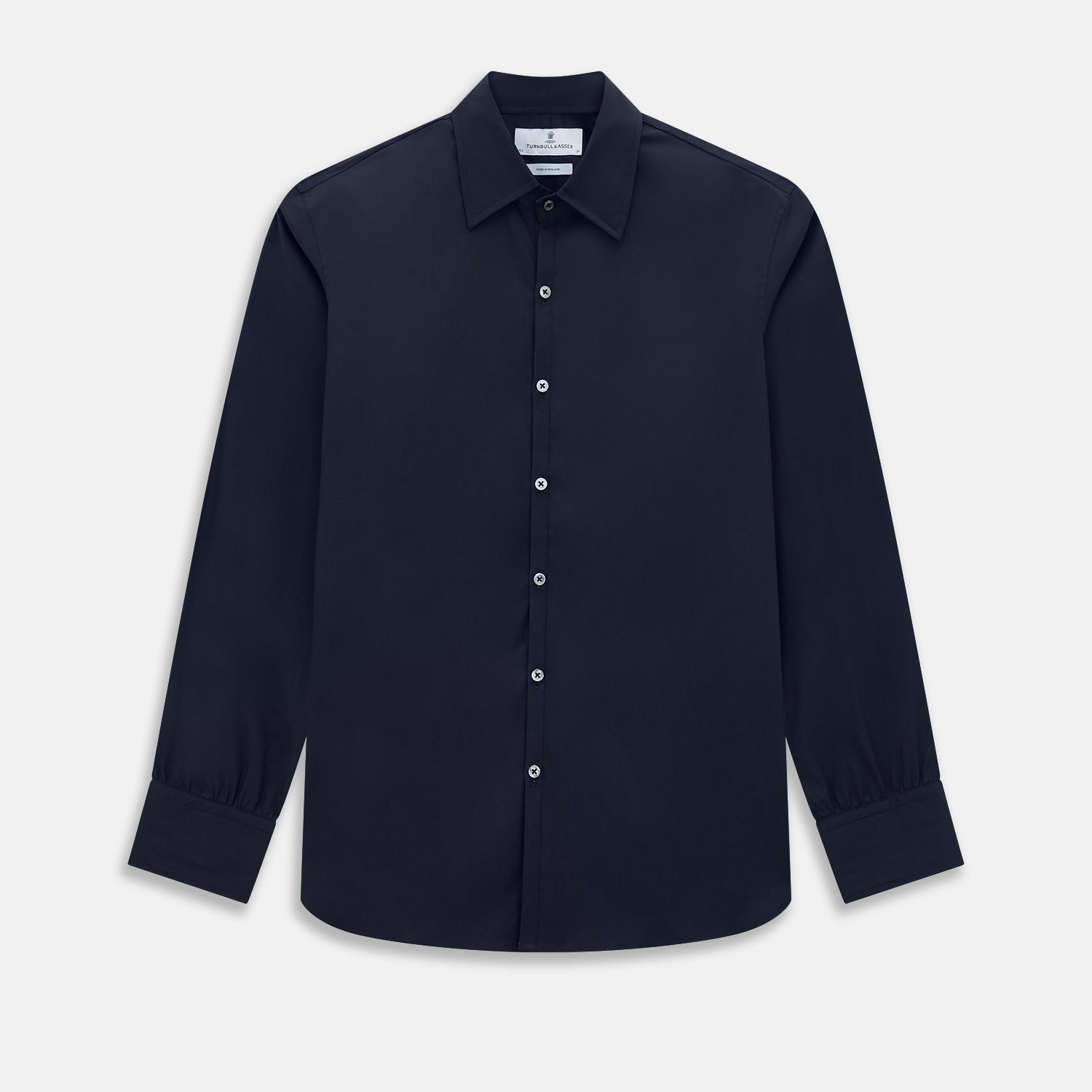 View 1 of product The Navy Westminster Shirt by Turnbull & Asser is a classic long-sleeve, button-up shirt with a pointed collar and buttoned cuffs, exemplifying British craftsmanship, shown against a plain white background.