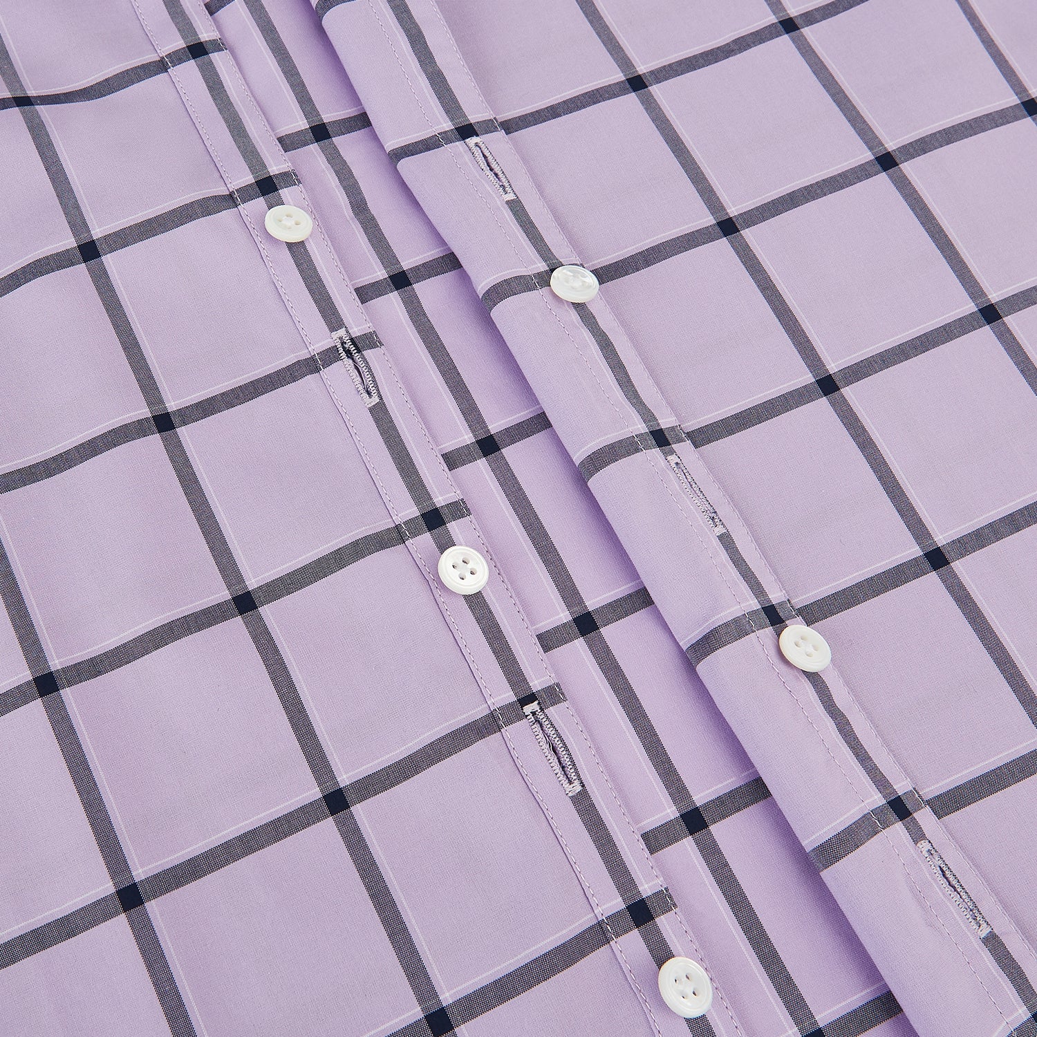 View 7 of product A long-sleeve, button-up Lilac Grid Check Windsor Shirt by Turnbull & Asser, featuring a black windowpane pattern and a refined Windsor collar, displayed on a plain white background.