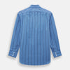 View 3 of product The Turnbull & Asser Colony Blue Track Stripe Mayfair Shirt is crafted from Italian cotton with long sleeves, dark blue track stripes, a classic collar, and buttoned cuffs, shown against a white background.