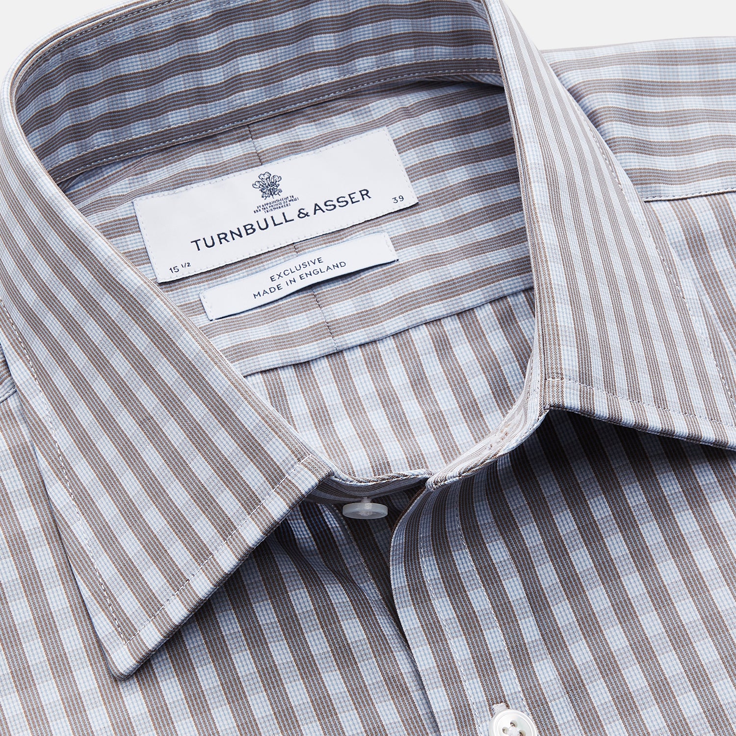 View 2 of product The Turnbull & Asser Pale Blue Multi Check Cotton Regular Fit Mayfair Shirt features a pale blue checkered pattern and long sleeves, shown on a white background.