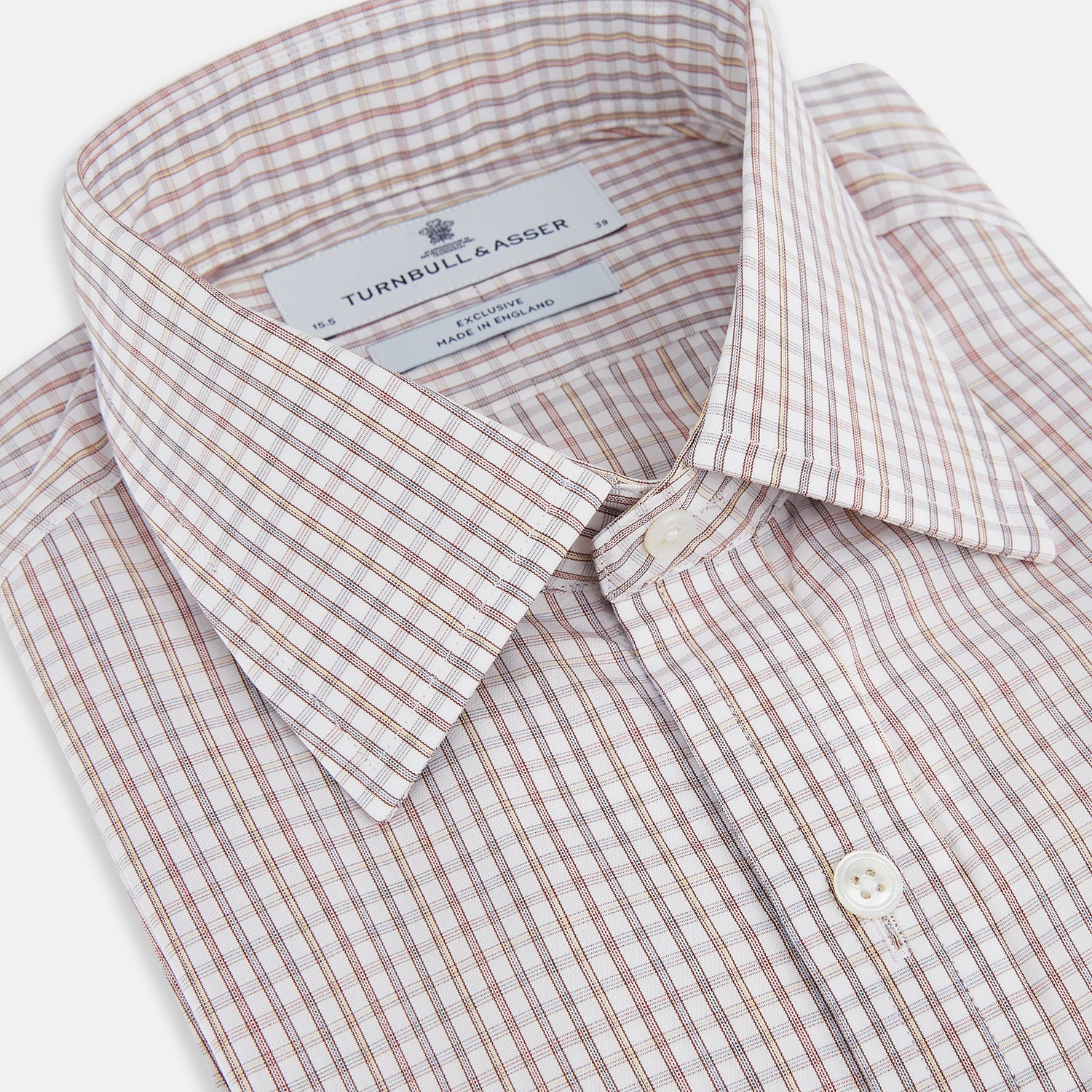View 2 of product The Turnbull & Asser Multicoloured Check Mayfair Shirt is a long-sleeve, button-up shirt with a classic collar and buttoned cuffs, showcasing a true British checkered pattern on a white background.