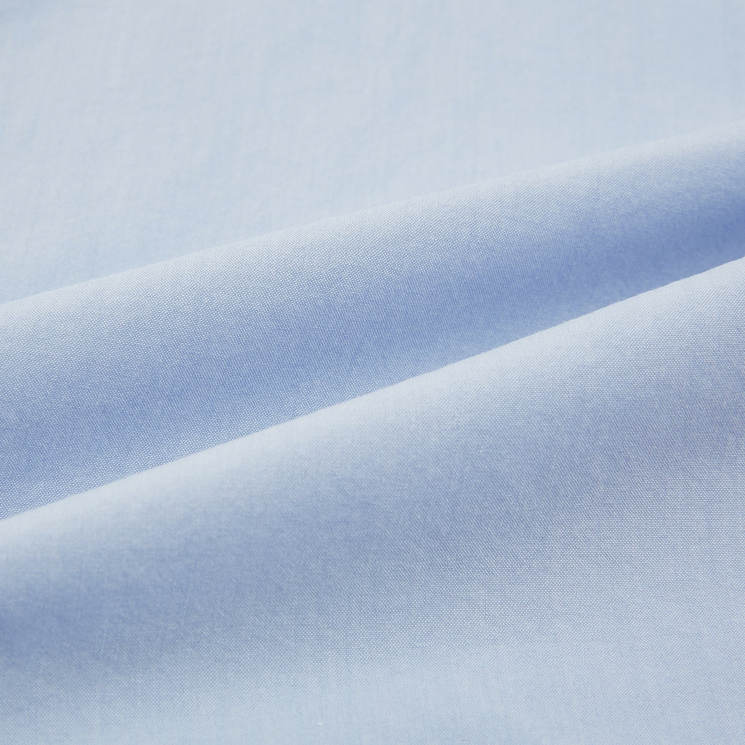 View 6 of product The Turnbull & Asser Pale Blue Hyde Overshirt is a long-sleeve, sanforised cotton button-up with a single chest pocket and dark buttons, shown on a plain white background.