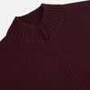 View 2 of product The Turnbull & Asser Burgundy Merino High Neck Zipped Cardigan features long sleeves, a zip-up front, and ribbed collar, cuffs, and hem, crafted from soft merino knitwear and shown on a white background.