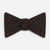 View 1 of product The Blue and Brown Micro Dot Silk Bow Tie by Turnbull & Asser features subtle blue micro dots on brown silk, photographed on a plain white background—a sophisticated men's accessory perfect for formal events.