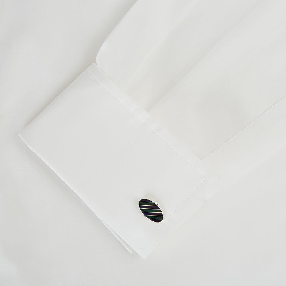 The Forest Green and Navy Striped Oval Enamel Cufflinks by Turnbull & Asser feature artisanal craftsmanship and a bold, masculine design, with elegant stripes set on a classic silver finish against a sophisticated white backdrop.