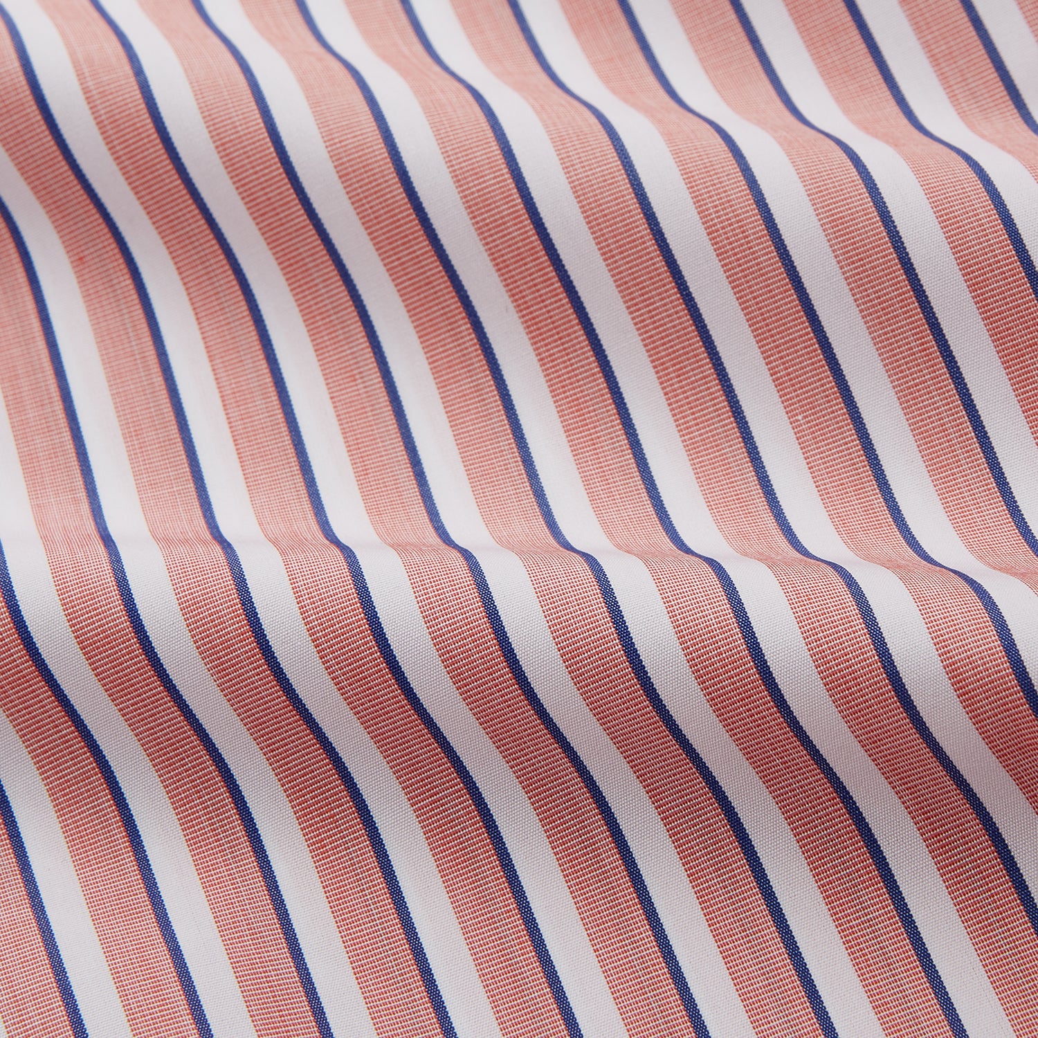 View 2 of product The Turnbull & Asser Orange and White Stripe Cotton Regular Fit Mayfair Shirt features vertical stripes, a classic collar, and buttoned cuffs—an essential men’s wardrobe piece, shown laid flat on a white background.