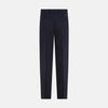 View 4 of product The Navy Rupert Trousers by Turnbull & Asser are tailored wool trousers with a button and zip closure, belt loops, and front creases, elegantly displayed against a plain white background.