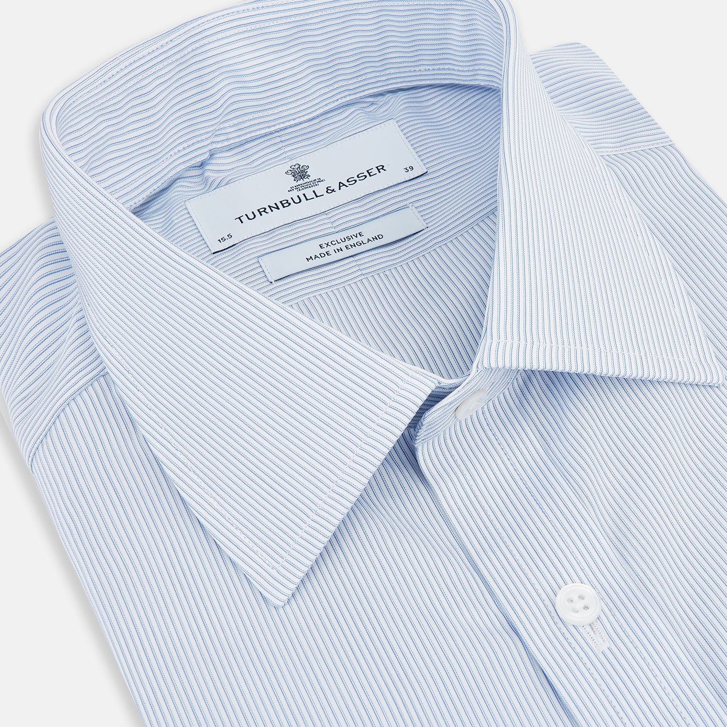 View 2 of product The Turnbull & Asser Sky Blue Hairline Multi Stripe Mayfair Shirt features Italian cotton, long sleeves, a classic collar, white buttons, and a subtle stripe pattern, shown on a plain white background.