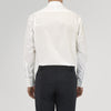 View 4 of product The Turnbull & Asser Tailored Fit Two-Fold 120 White Cotton Shirt features a Kent collar, double cuffs, and button-down front, displayed neatly folded against a light blue background.
