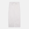 View 5 of product The Turnbull & Asser Women's Harriet Plain White Cotton Pyjama Set features long sleeves, black piping, a chest pocket, and matching pants with elastic waistband and ribbon tie, all displayed on a white background.