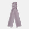 View 1 of product The Lilac Cashmere Scarf by Turnbull & Asser features a soft texture and unfinished, slightly frayed edges—an elegant accessory for any formal wardrobe.