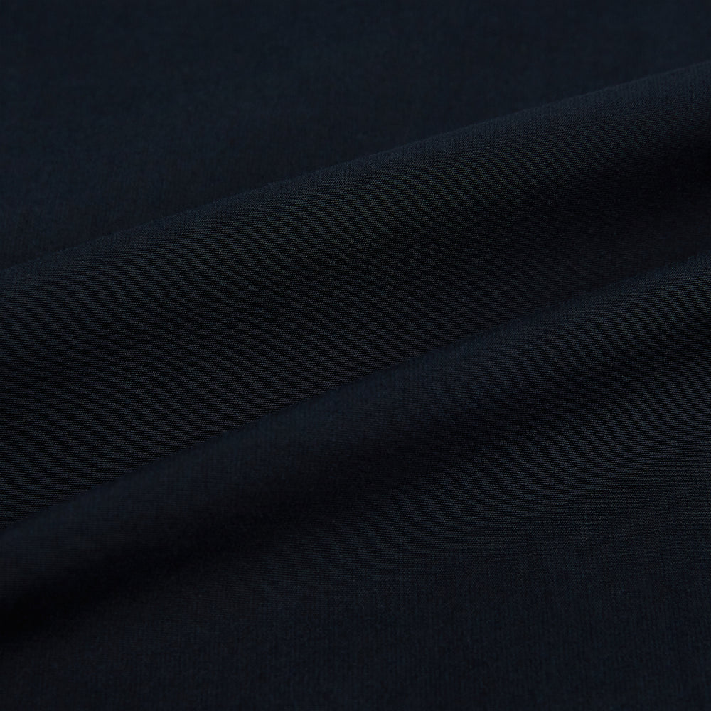 The DARK NAVY WINDSOR SHIRT by Turnbull & Asser is a long-sleeve shirt with a refined Windsor collar, showcasing classic British craftsmanship.