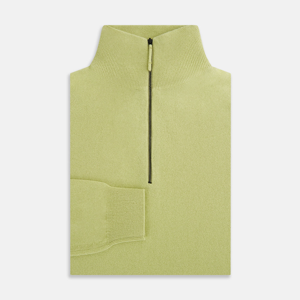 The Turnbull & Asser Melon Green Half-Zip Cashmere Jumper features long sleeves, a high collar, and half-zip front—ideal knitwear for layering. Shown on a plain white background.