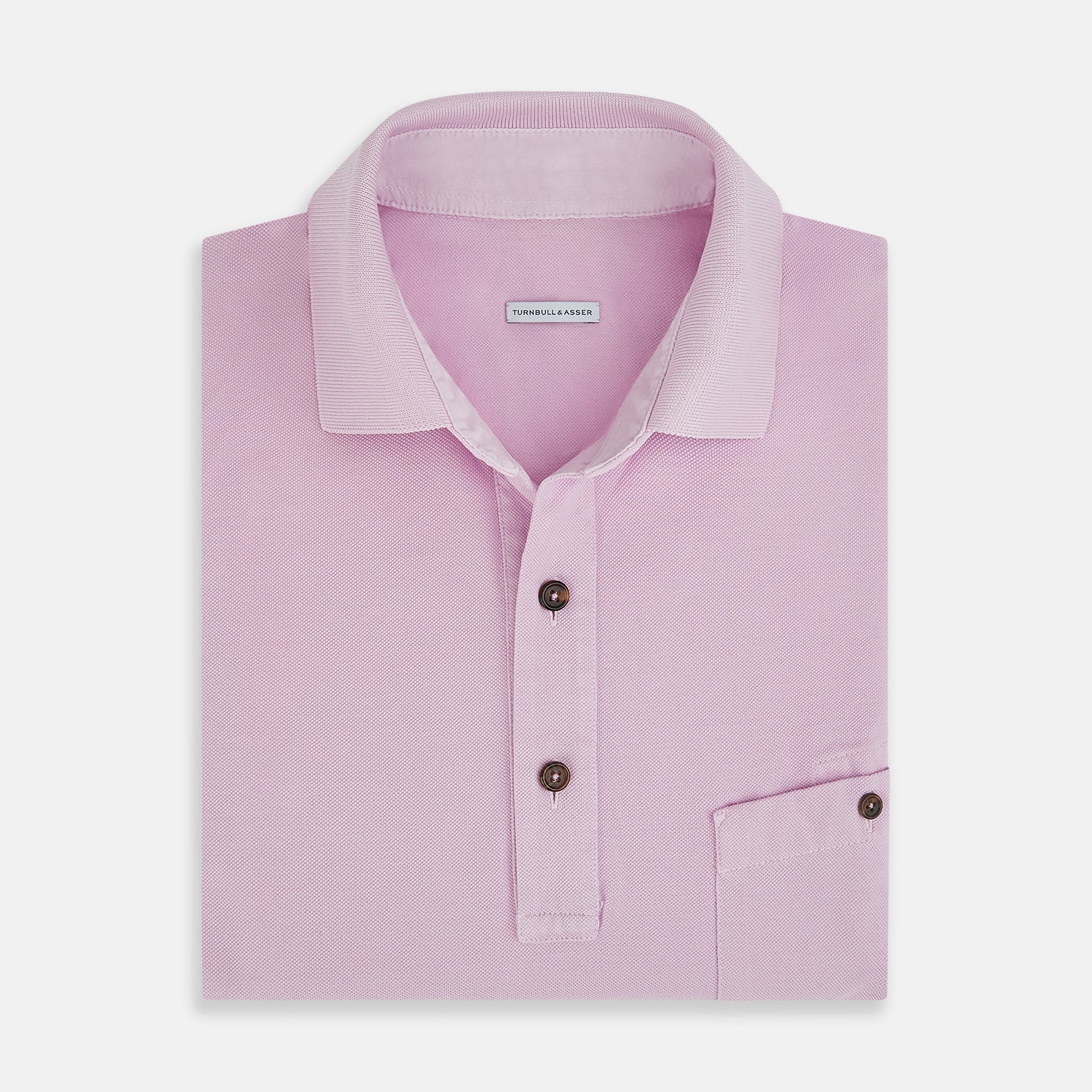 View 4 of product The Turnbull & Asser Pink Polo Shirt is a men's cotton polo with short sleeves, a collar, three dark buttons, and a chest pocket with a button, shown laid flat on a white background.