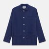 View 5 of product The Turnbull & Asser Blue and Navy Candy Stripe Silk Hyde Pyjamas Set features a long-sleeve button-up top with a chest pocket and elastic-waist pants, shown on a plain white background.