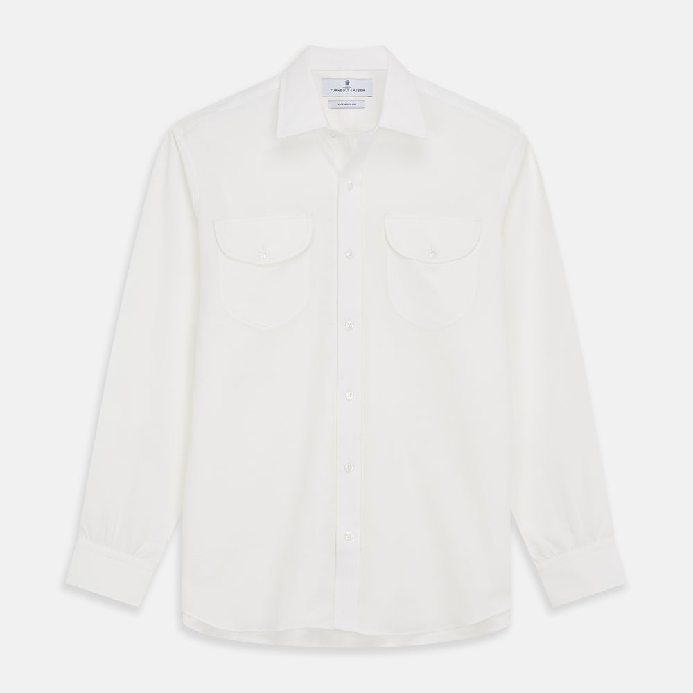 The White Cotton Weekend Fit Langston Shirt by Turnbull & Asser, with a Derby collar, long sleeves, and two button-flap chest pockets, is shown laid flat on a white background.