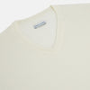 View 8 of product The Turnbull & Asser Cream Fine Merino V-Neck Jumper features long sleeves and classic styling, displayed against a white background.