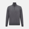 View 1 of product The Turnbull & Asser Grey Half-Zip Cashmere Jumper features long sleeves, a high collar, and premium yarn in dark gray. This classic knitwear is showcased against a white background.