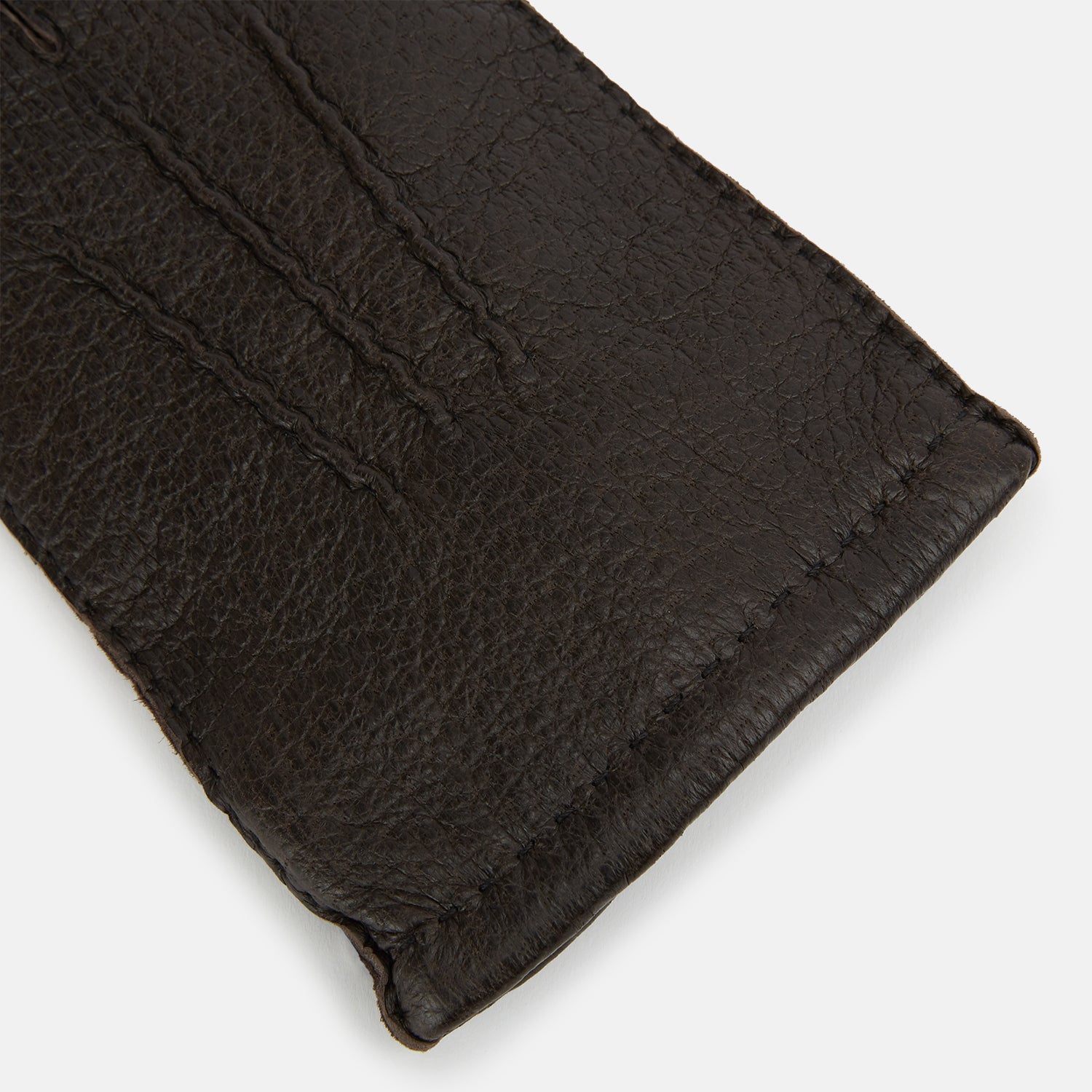 View 2 of product Turnbull & Asser's Dark Chocolate Cashmere-Lined Peccary Leather Gloves feature visible stitching, a buttoned strap on the palm side, and luxurious Scottish cashmere lining for superior comfort.