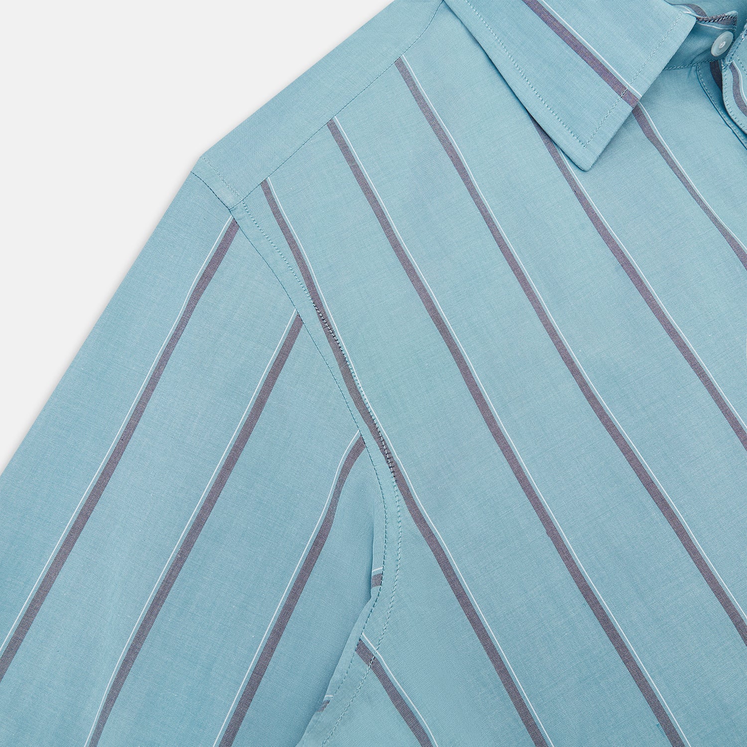 View 6 of product The Cendre Blue Track Stripe Westminster Shirt by Turnbull & Asser features a light blue hue, dark vertical stripes, button-down front, classic collar, and buttoned cuffs—showcasing British craftsmanship.