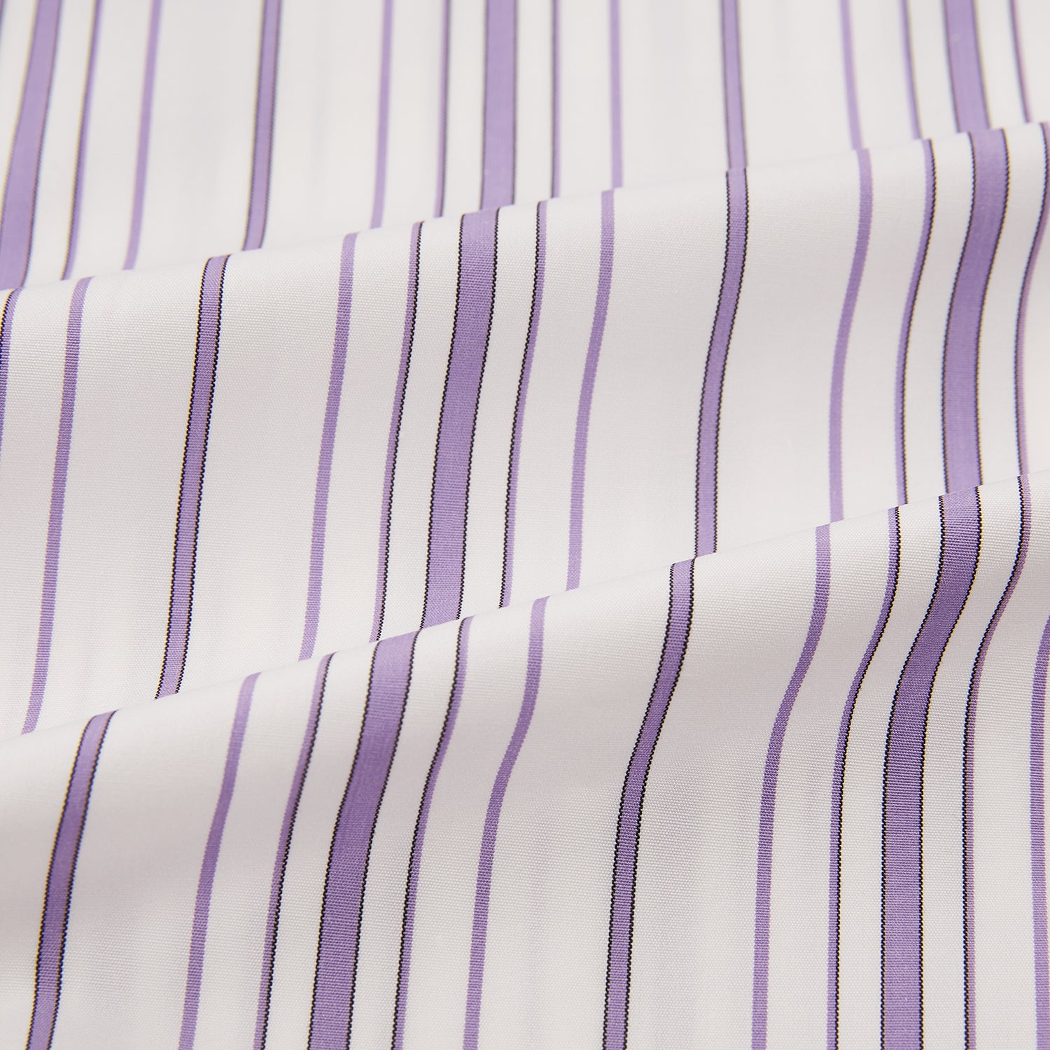 View 6 of product The Purple Multi Stripe Mayfair Shirt by Turnbull & Asser is a long-sleeve, collared button-up featuring vertical blue and purple stripes on white, ideal for formal occasions. The shirt is neatly displayed flat against a white background.