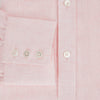 View 4 of product The Turnbull & Asser Pale Pink Linen Mayfair Shirt features a classic, formal style with long sleeves, a collar, and white buttons. Shown laid flat on a white background.