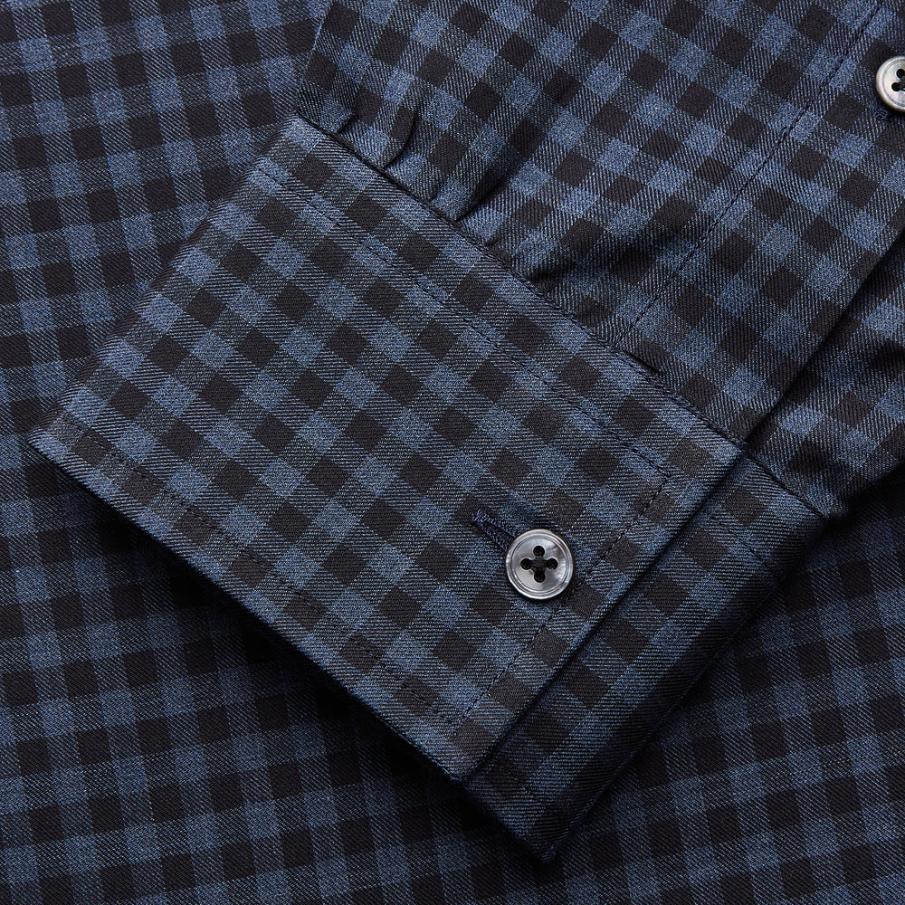 The Turnbull & Asser Navy Check Cotton Weekend Fit Blake Shirt features a long-sleeve, button-up design with a stand collar and white buttons, shown on a white background.