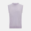 View 1 of product The Turnbull & Asser Lilac Cashmere Round Neck Vest is a sleeveless piece with a ribbed hem, ideal as a lightweight layer, shown here on a plain white background.