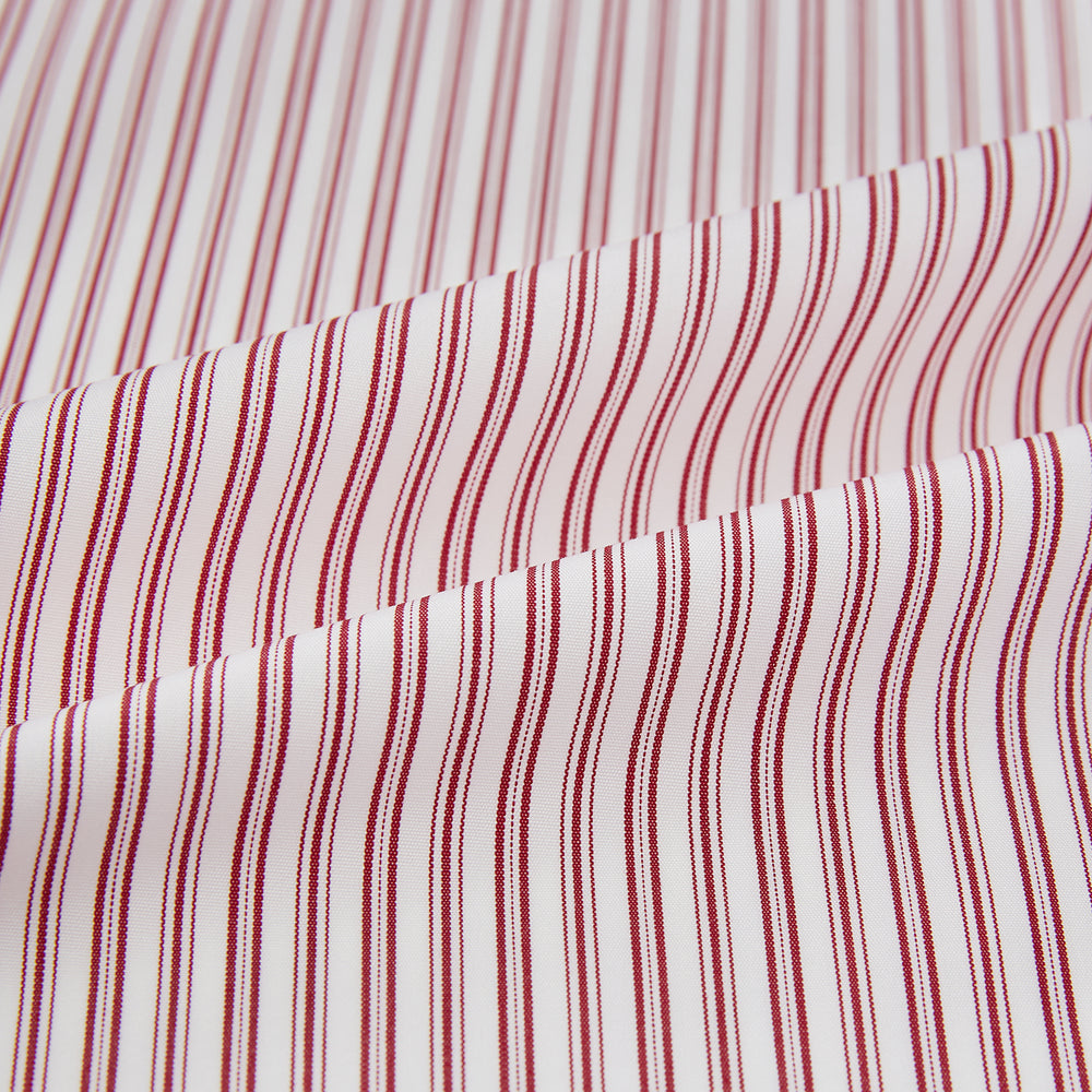 The Red Ticking Stripe Westminster Shirt by Turnbull & Asser features long sleeves, a button-up front, and vertical red and white stripes, shown flat on a white background.