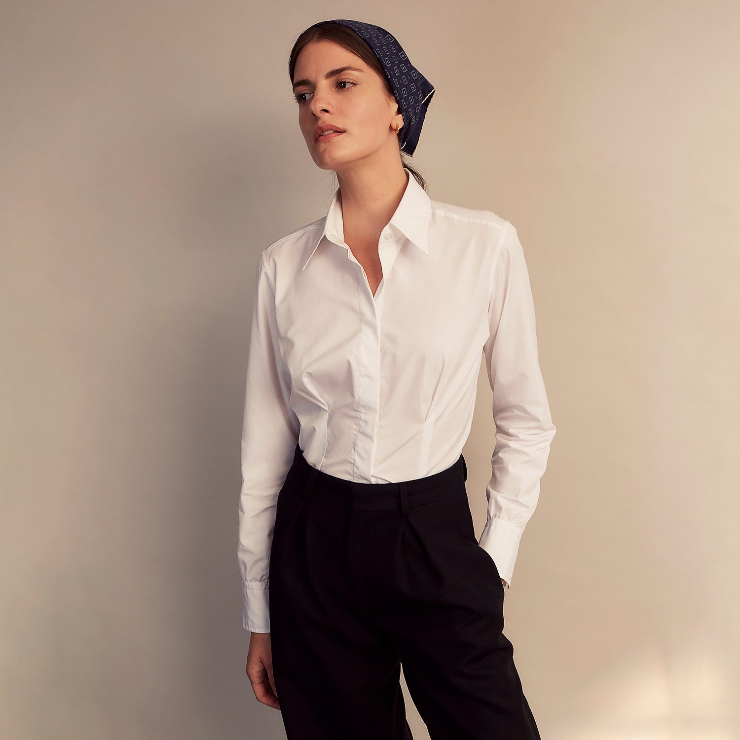 View 4 of product The White Cotton Tailored Bianca Shirt by Turnbull & Asser features a pointed collar and button cuffs, crafted from soft organic cotton and displayed flat on a white background for timeless elegance.