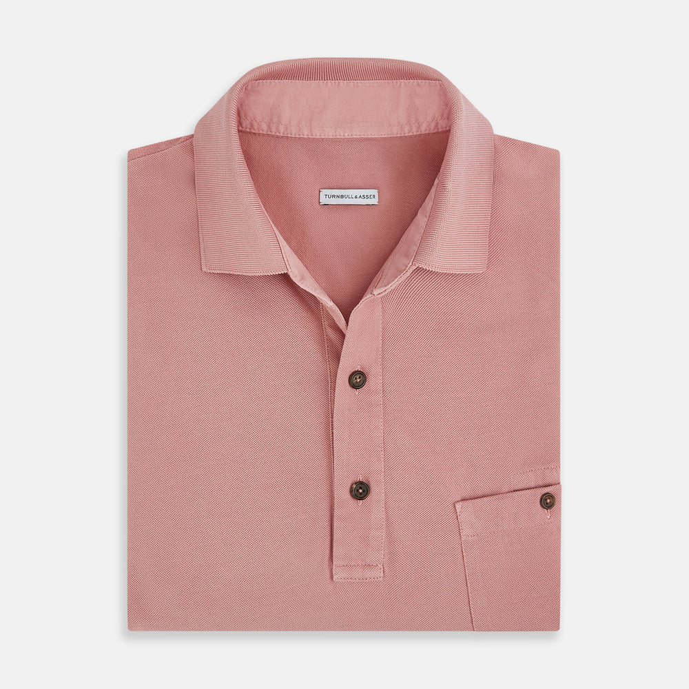 The Turnbull & Asser Red Polo Shirt is a men's cotton polo with short sleeves, a collar, a three-button neckline, and a buttoned chest pocket. The shirt is shown laid flat on a white background.