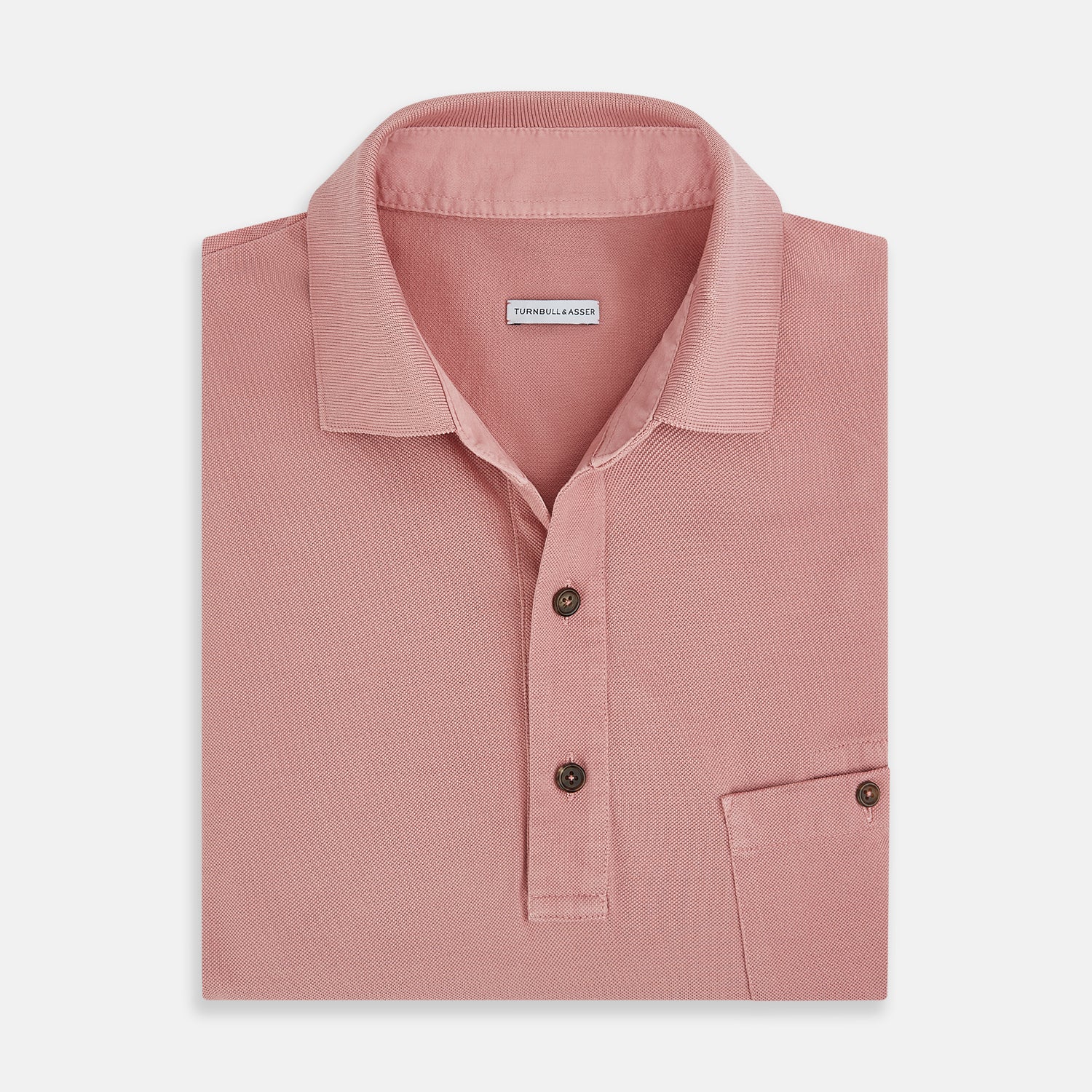 View 4 of product The Turnbull & Asser Red Polo Shirt is a men's cotton polo with short sleeves, a collar, a three-button neckline, and a buttoned chest pocket. The shirt is shown laid flat on a white background.