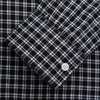 View 2 of product The Turnbull & Asser Black Multi Check Cotton Blend Weekend Fit Hayne Shirt features a Dorset button-down collar and white buttons, with a black and white plaid pattern, shown laid flat on a white background.